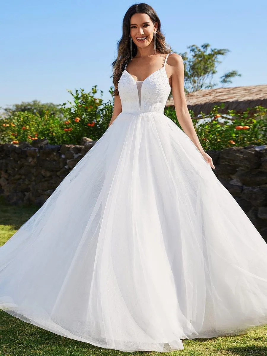 Robes de mariée trapèze à col en V et bretelles spaghetti, embellissements de perles
