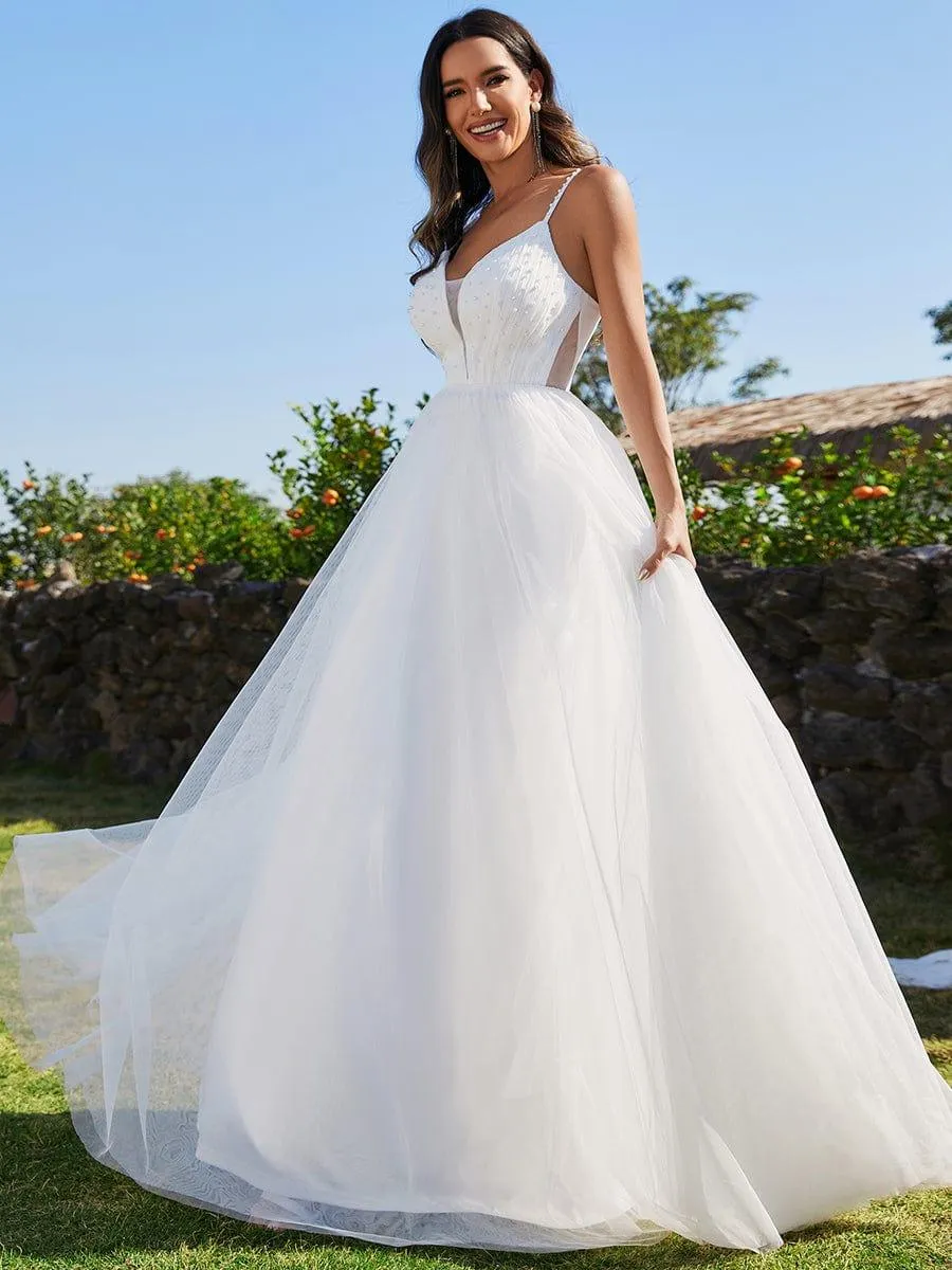 Robes de mariée trapèze à col en V et bretelles spaghetti, embellissements de perles